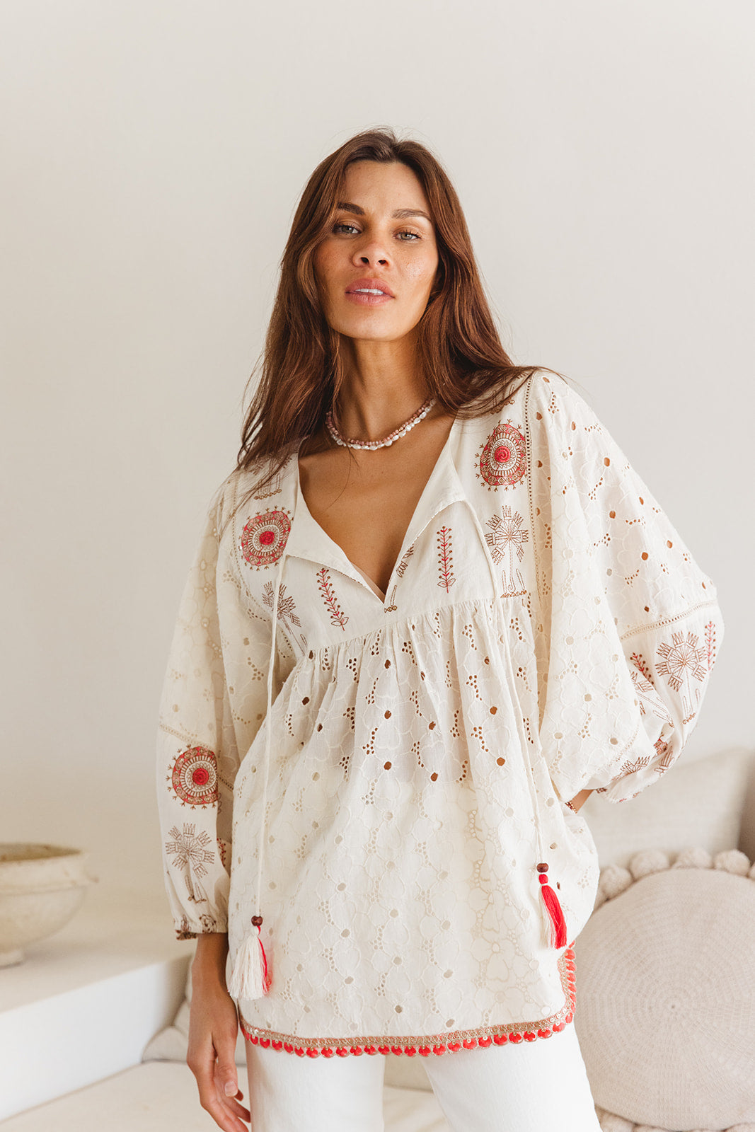 Woman in embroidered long blouse 