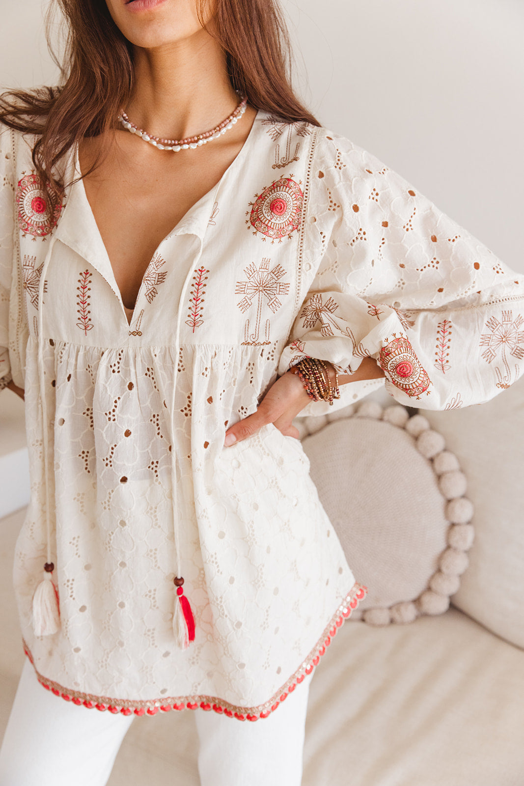 Woman in embroidered long blouse 